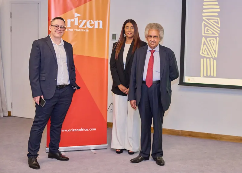 Three guests beside the Arizen banner at the summit